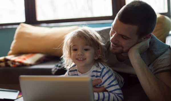 A parent and child reading a book